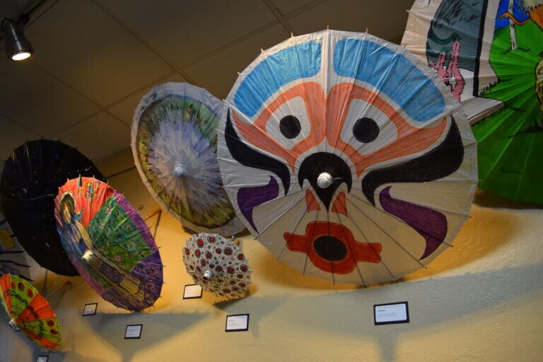 Painted umbrellas with colorful designs.