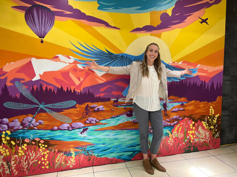 Passenger posing with the RNO interactive mural.