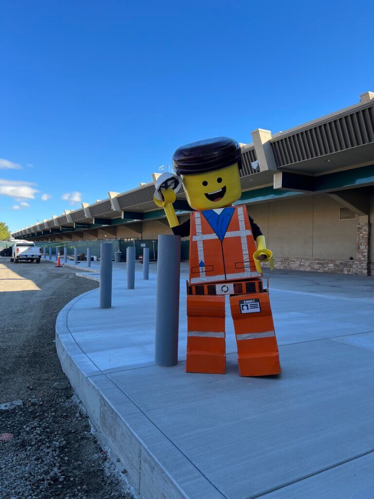 Team member wearing a Lego costume outside RNO.