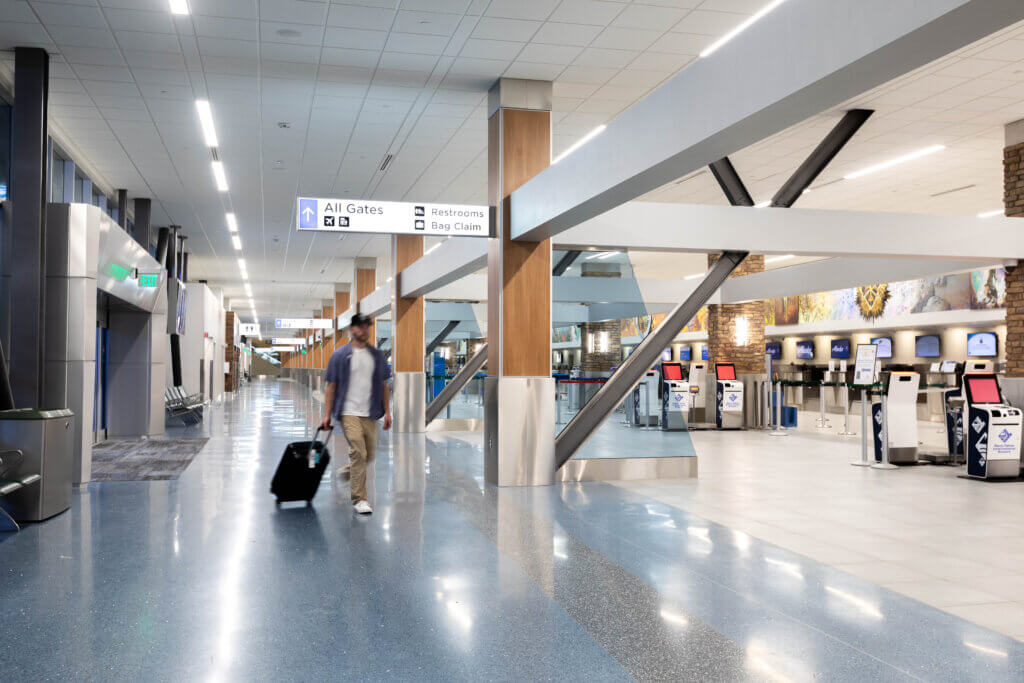 Ticketing-Hall walkway with architectural elements including beams and panels.