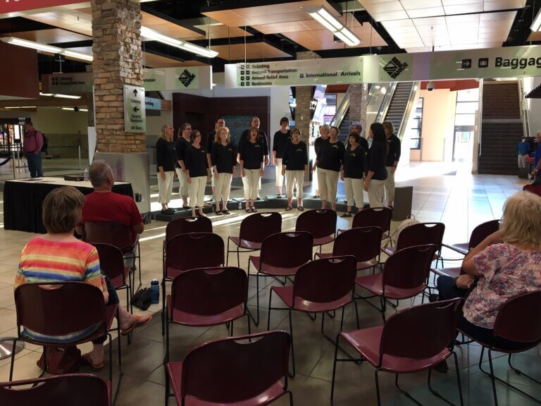 High Desert Harmony performing at the airport.