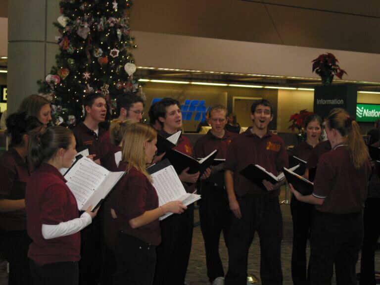 Sparks High Chamber Choir performing at the airport.