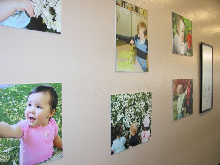 Exhibition wall with photographs from Children… Discover, Investigate, Learn Exhibition.