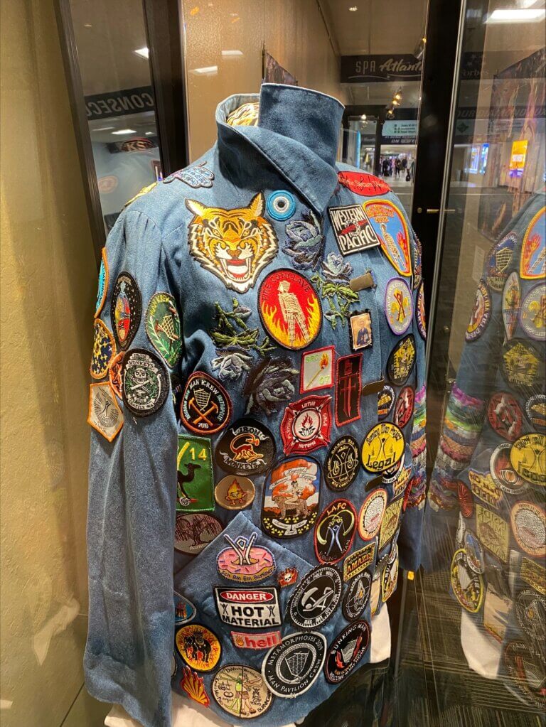 Jacket made of jean material with various Burning Man patches.