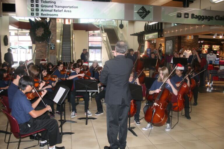 Pine Middle School Orchestra performing for the holidays at RNO.