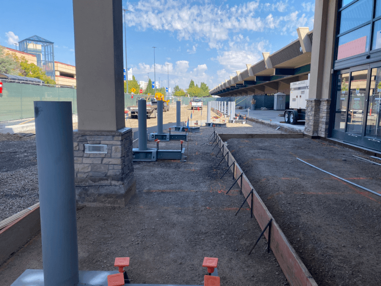 Airport entrance with asphalt and staging for concrete