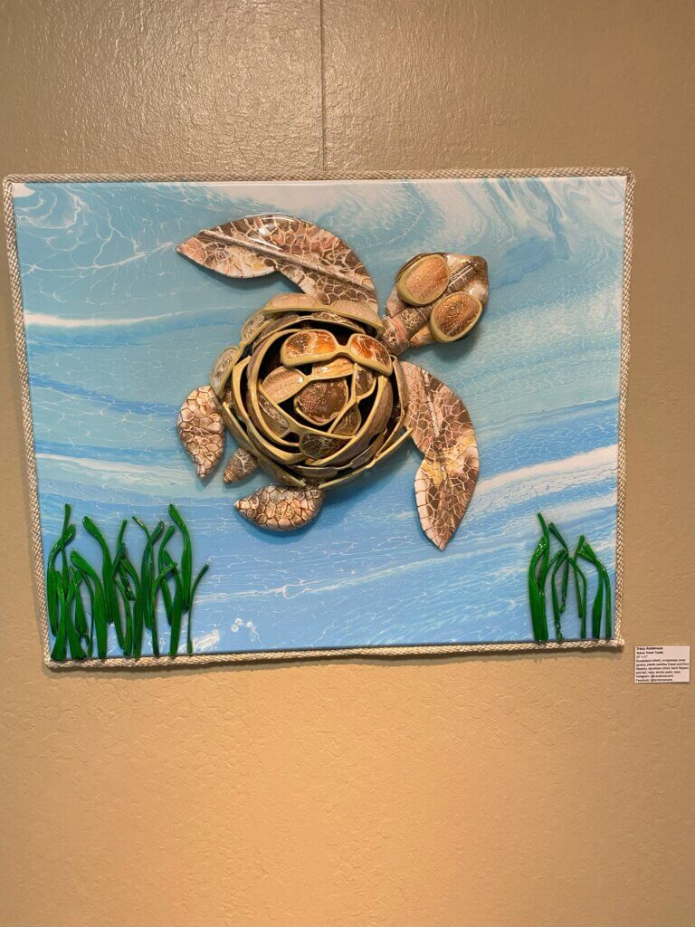 Art piece made from recycled materials in the shape of a sea turtle.