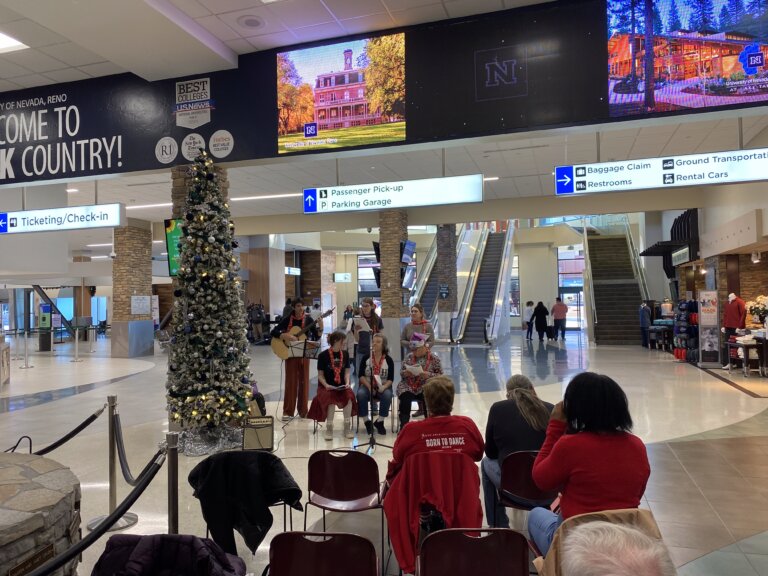 Local Vocals chorus performing at the airport for the holidays.